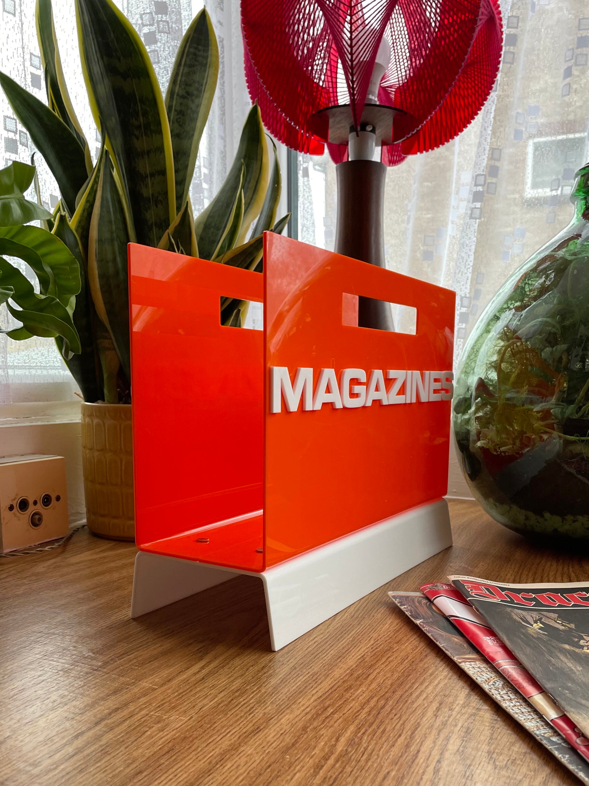 orange acrylic magazine rack
